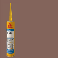 A 10.1 oz tube of SIKA Sikaflex 15LM Elastomeric Sealant with a yellow nozzle is set against a brown background, displaying construction applications and detailed product information on its label.