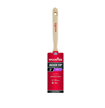 The WOOSTER Silver Tip Paint Brush, featuring a red wooden handle and a 2-inch brush width, is ideal for precision painting. The packaging emphasizes its ability to provide smooth coverage for the finest finish and compatibility with all types of paint. The handle is adorned with the WOOSTER logo in red.