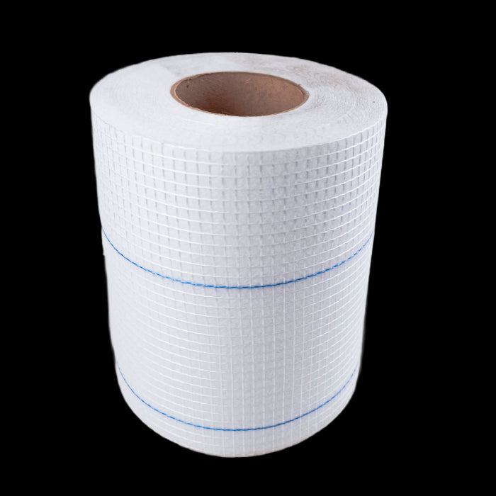 The ALSAN RS Fleece Waterproofing Roofing Reinforcement by Soprema, sized 41.3 x 164, features a roll of white grid-patterned polyester with a brown cardboard center and a blue line, ideal for various waterproofing construction projects.