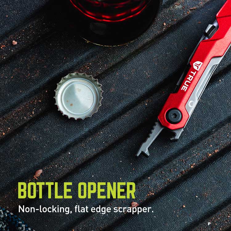 The TRUE TRU-MTL-1007 Titanium Block 5-in-1 Multitool, featuring a red bottle opener with a flat edge scraper sits on a dark surface next to an open cap. Text highlights BOTTLE OPENER and Non-locking, flat edge scrapper, emphasizing its patent-pending design within the versatile tool setup.